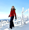 GIRL IN SKI CLOTHES IN THE SNOW