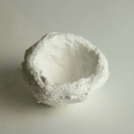 Textured white sculptural vessel from Steve Roberts’ Presence series, shown from an angled top view, highlighting the hand-formed organic surface and hollow interior.