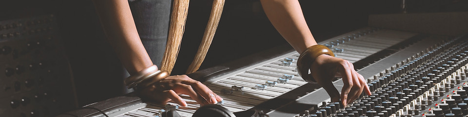 Woman Working at Mixing Console