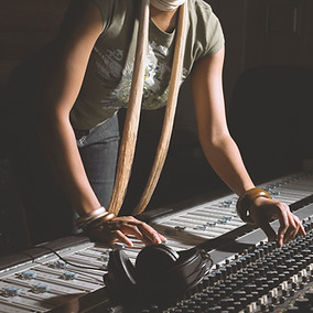 Woman Working at Mixing Console