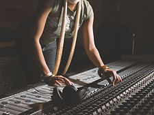 Woman Working at Mixing Console