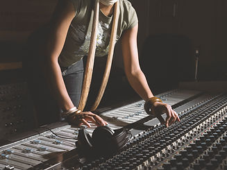 Woman Working at Mixing Console