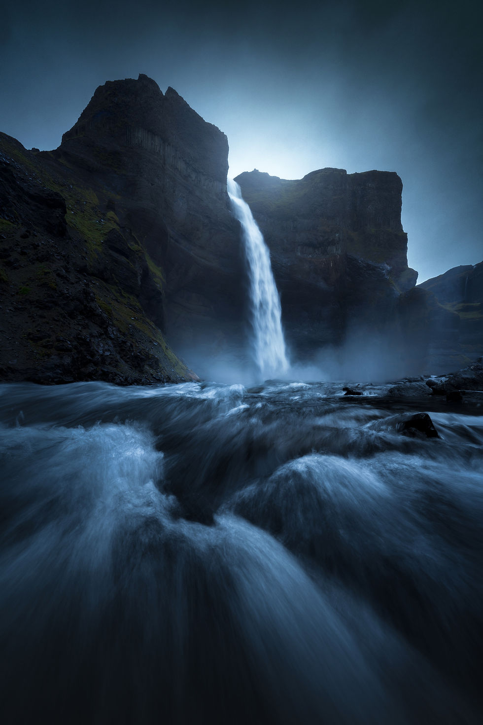 Háifoss waterfall in the Iceland Highlands photographed from the lower canyon with powerful foreground water