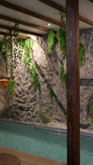 Spa with pool, wooden beams, and decorative plants, EvasionPrivée inside.