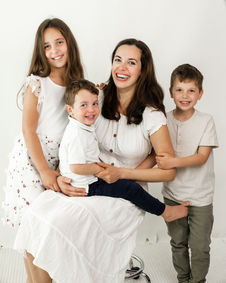Mother with three children studio family portrait St Albans family photographer
Hertford Newborn Photographer | Baby Boy Blue Knit Bonnet Posing