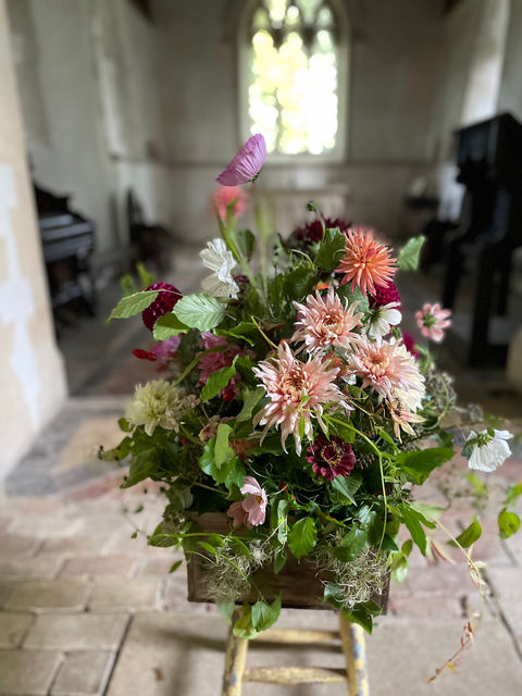 Autumnal dahlias, wine box, funeral farwell flower arrangement.