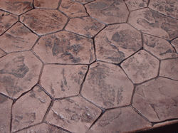 Russett Concrete with Charcoal Highlights Random Stone Closeup