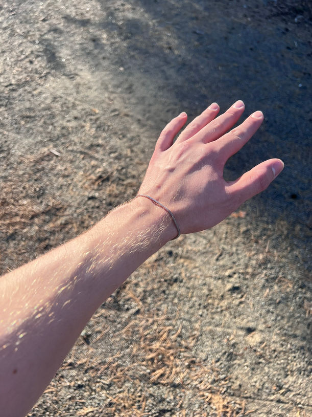 man wearing minimal bracelet stainless steel