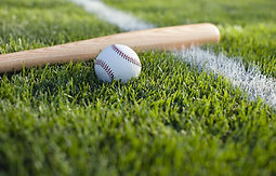 Baseball bat and ball left on the ground