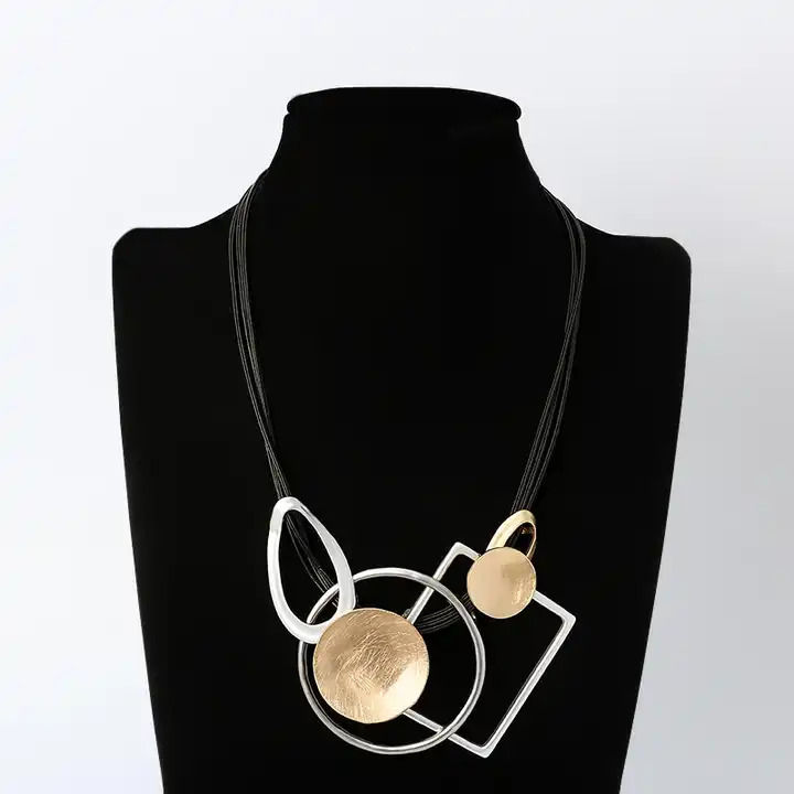Thumbnail: Cynthia necklace, geometric shapes on a 3 strand wax cord