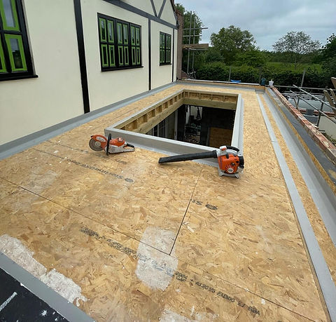 image of flat roof and skylight installation