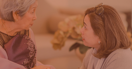 An adult child talking to their mother about decluttering.