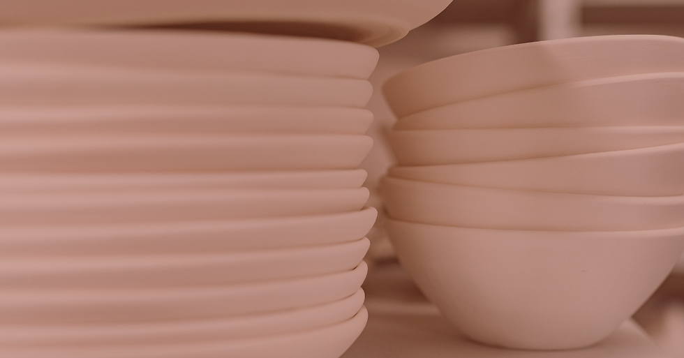 A stack of dishes can be a useful but unused item that people debate decluttering.