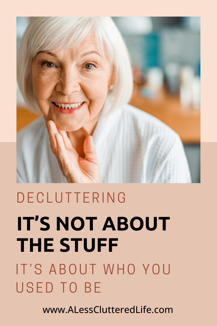 A gray-haired woman looking in a mirror sees how her possession have changed with her identity.