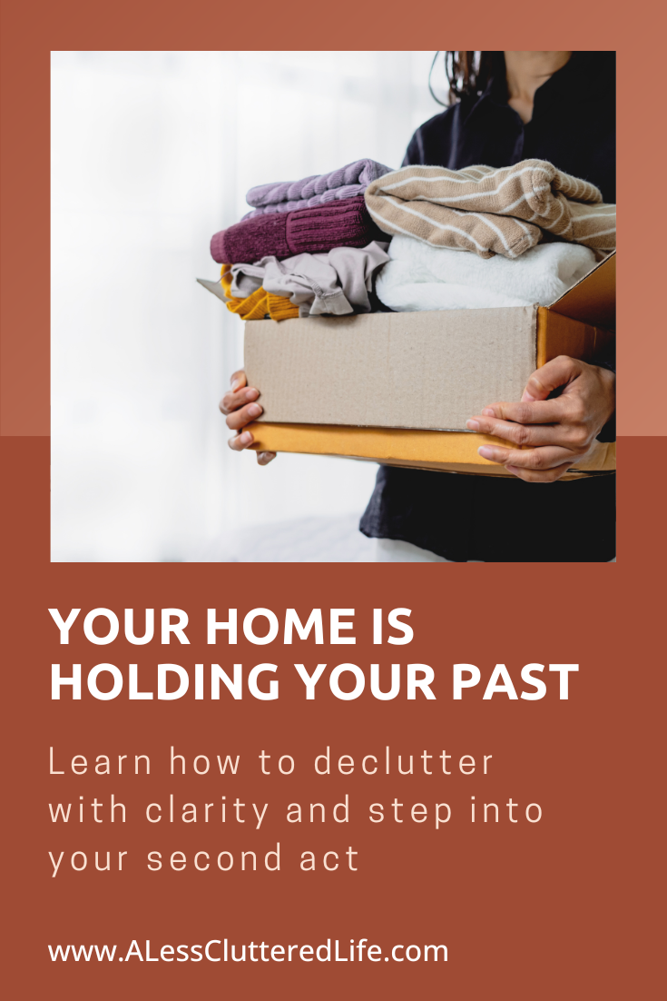 Before decluttering this box of clothing, this woman had to decide who she is in her second act.