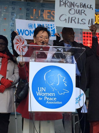 Soon-Young Yoon speaks at podium for UN Women for Peace Association.