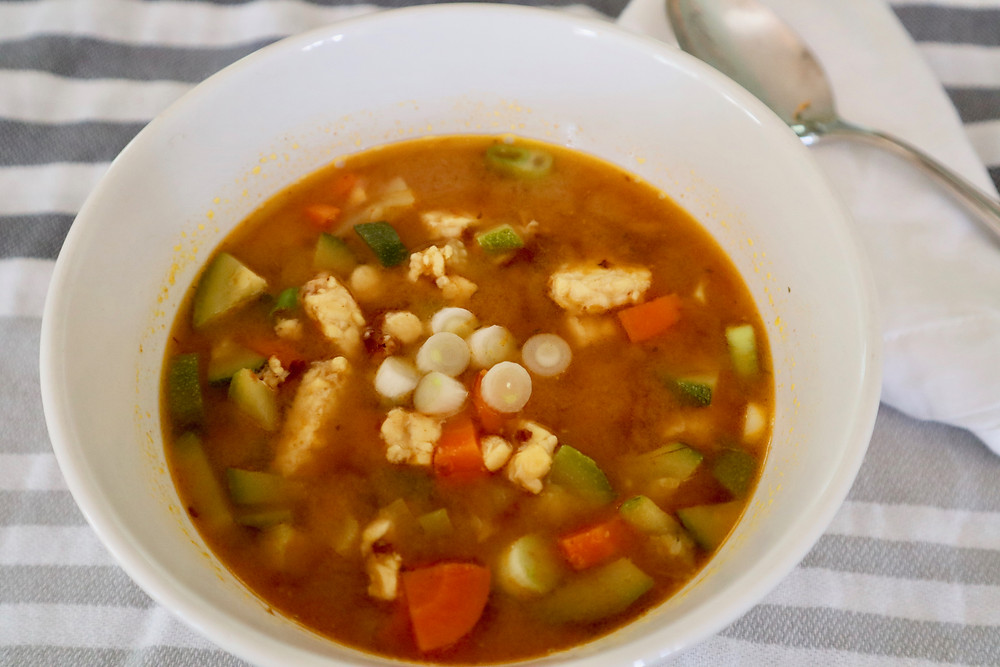 A comforting soup with a rich broth and chock full of vegetables.