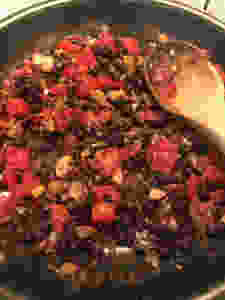 Pasta sauce with tomatoes, raisins, and chestnuts.