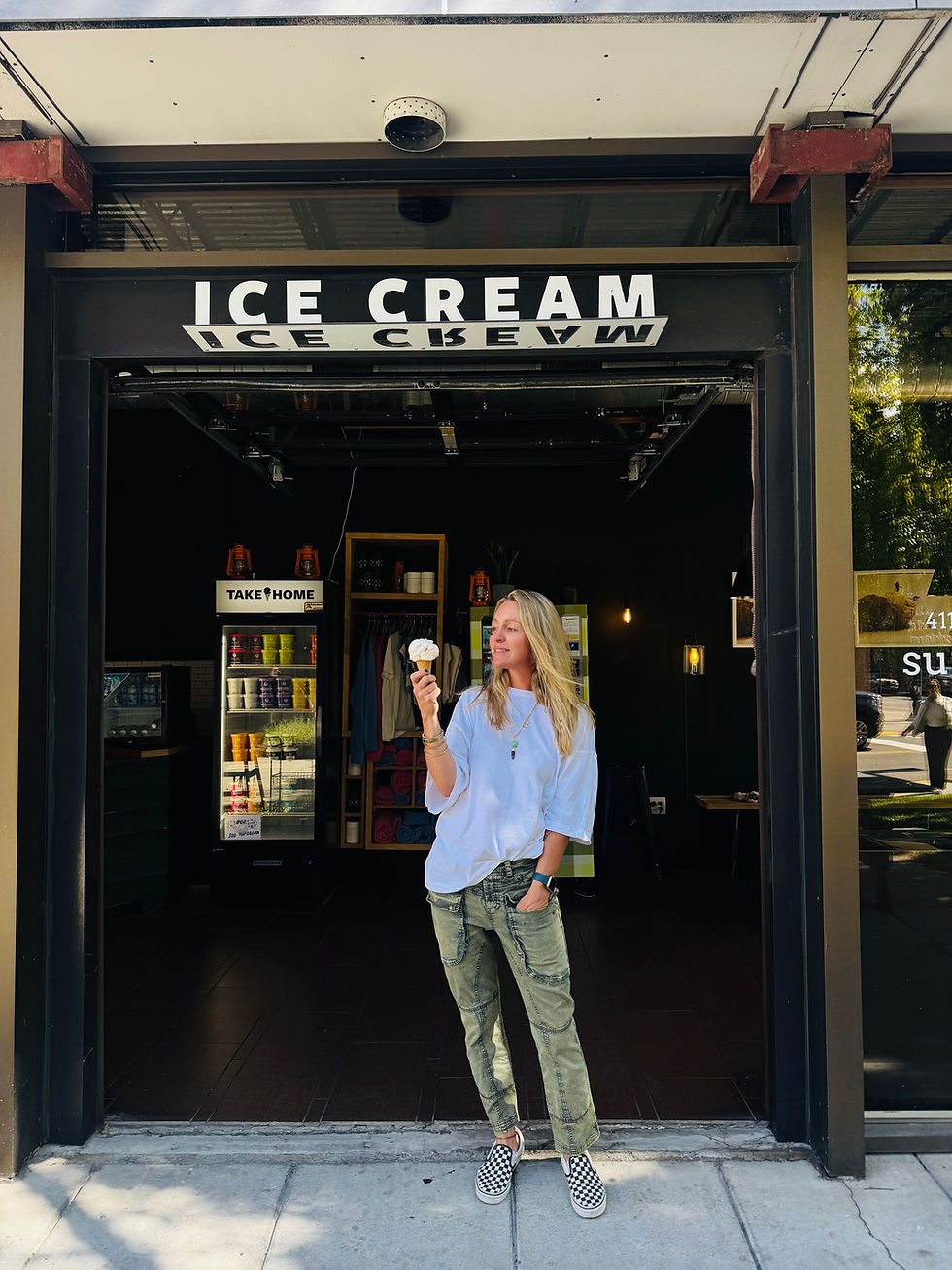 Marissa Keenan poses in front of Bozeman shop with an ice cream cone