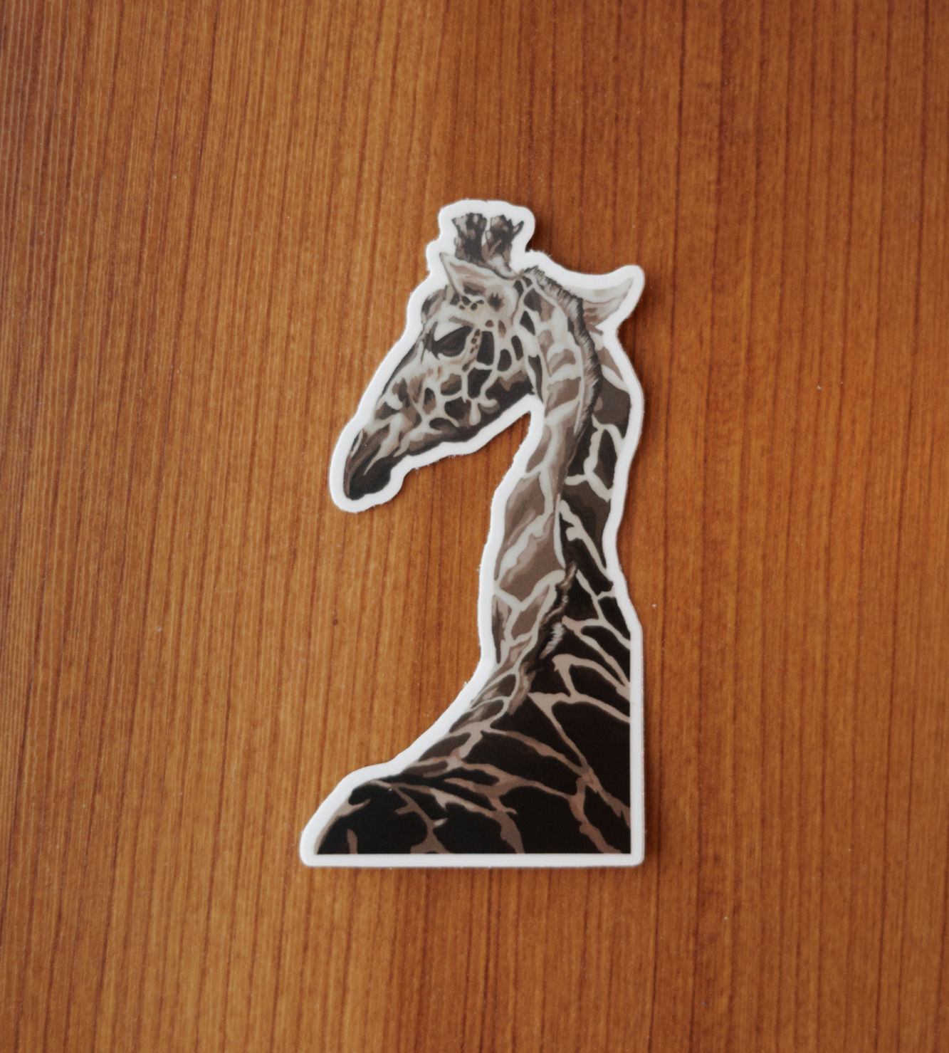 sticker of a brown and cream giraffe