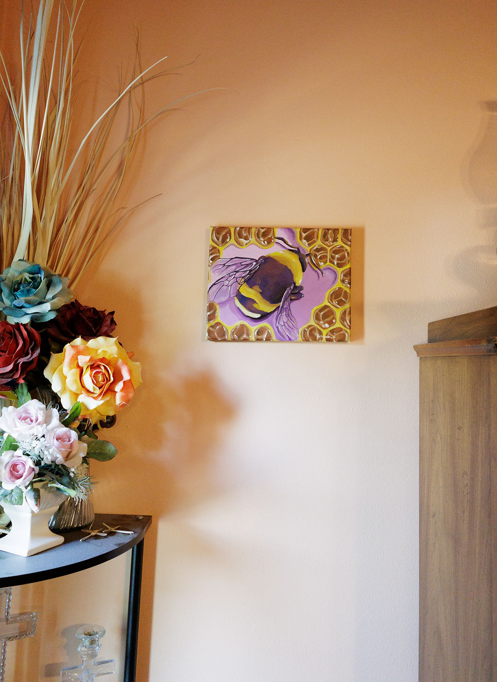 Thumbnail: purple and yellow bumblebee surrounded by honeycomb and a purple background, on a cream wall