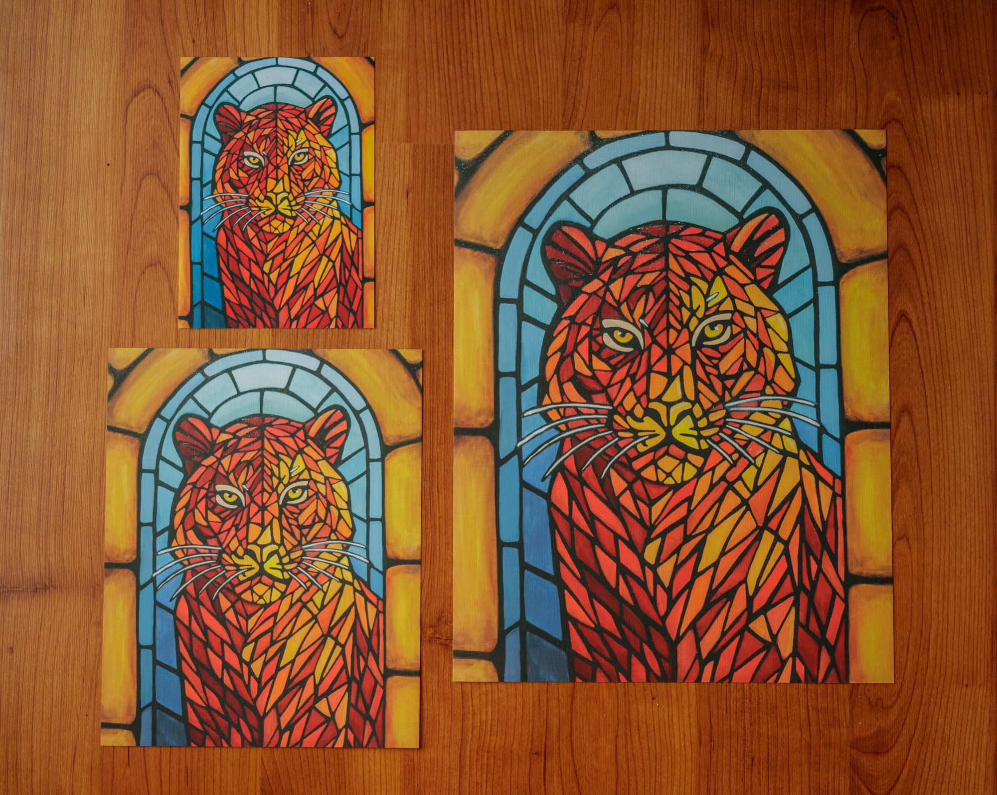 red, orange, and yellow stained glass tiger in front of a blue stained glass arch surrounded by yellow stones