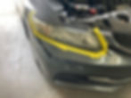 Headlight restoration in an auto upholstery gallery Sarasota