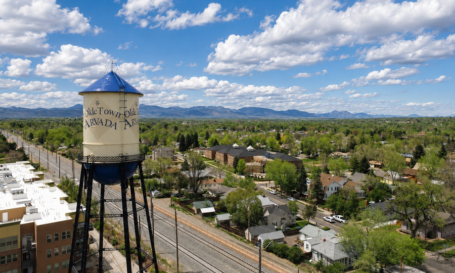 Olde Town Arvada water tower with the Front Range in Arvada, Colorado