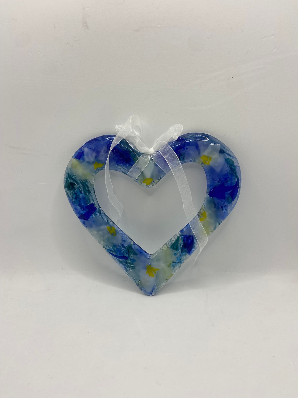 Thumbnail: fused glass open heart in blue tones with flowers