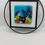 Thumbnail: black cat in a fused glass floral scene