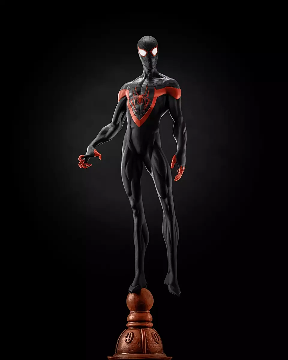 Spiderman statue standing over the tip of a building