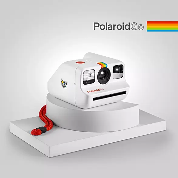 Polaroid instant camera on white pedestal