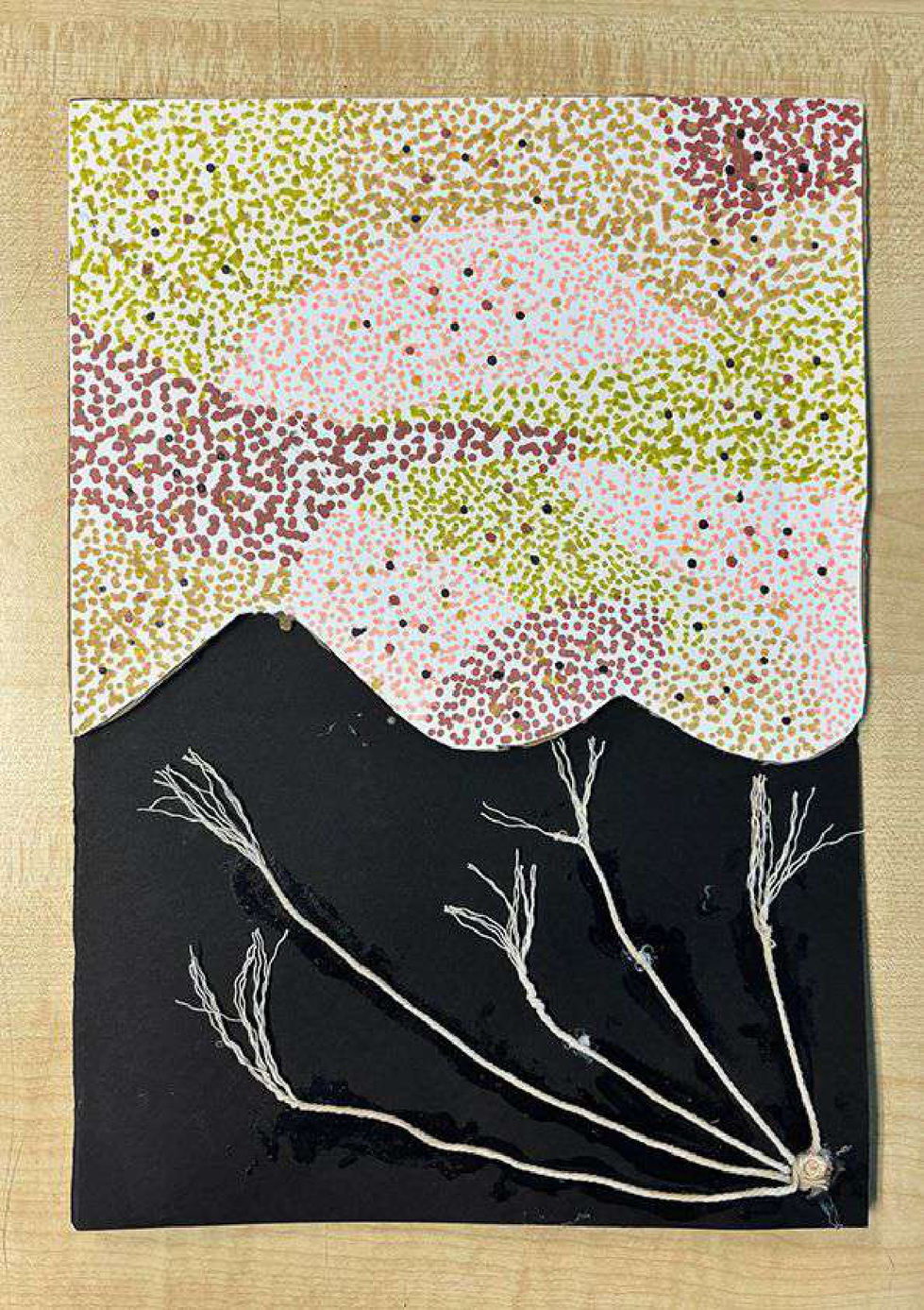Materials: Negative space, thread, cardboard, acrylic markers (pointillism), muted color
paletteTo show loneliness, I used negative space intentionally. The thread originates from a
sunken pit, which represents me. It symbolizes my efforts to connect with the masses —
efforts that always fell short. I used acrylic markers for pointillism to represent my
friends, who all seemed ahead of me, which is why I placed them on a raised
cardboard. The muted palette emphasizes the emotional silence of the moment.