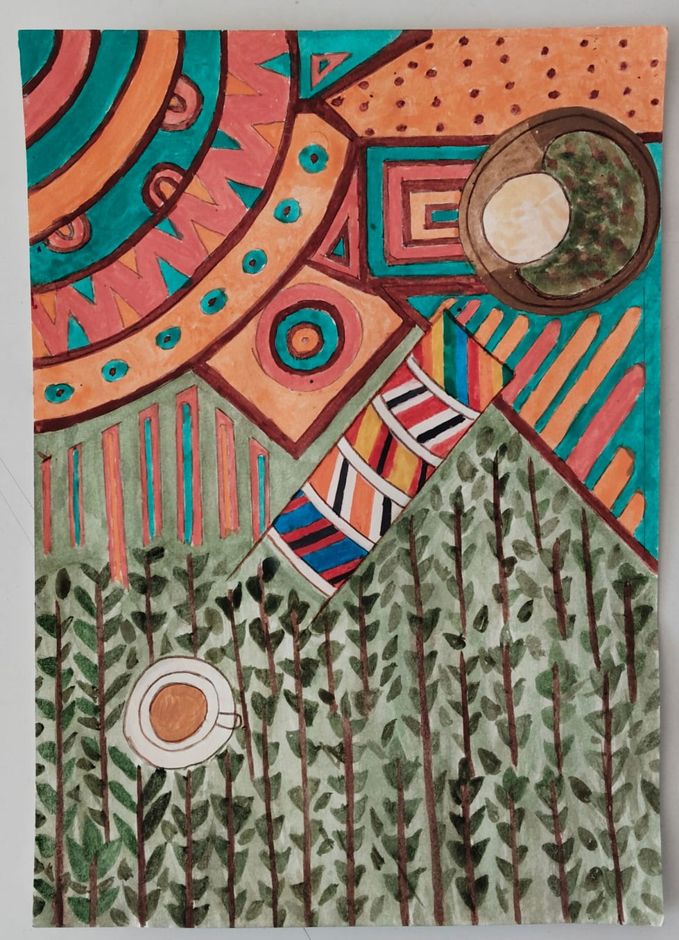 The final cultural postcard with tea, beads, a plate of food and a kitenge pattern.