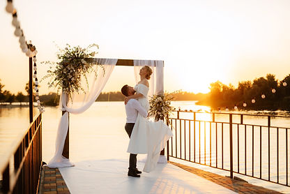 bride-and-groom-against-the-backdrop-of-a-yellow-s-2025-01-08-11-39-09-utc.jpg