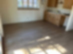 Modern wood flooring in a bright kitchen area.