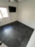 Black tile floor installation