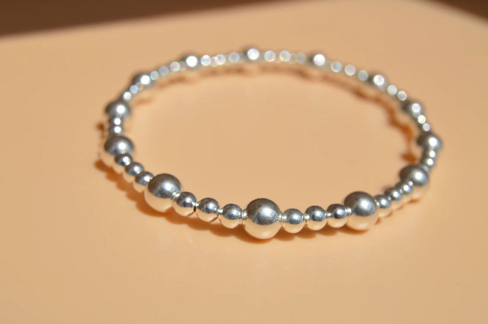 Thumbnail: large and small bead silver stretchy bracelet