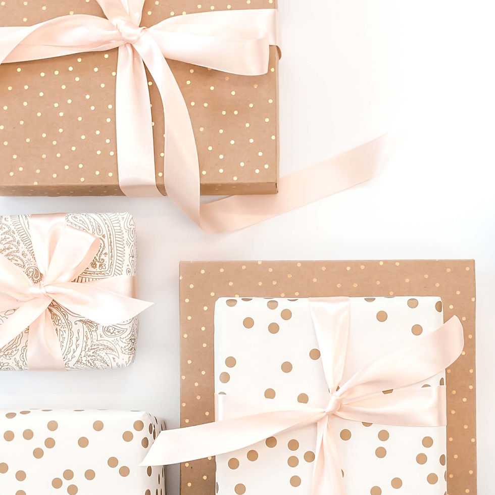 gifts wrapped in craft paper with pink bows