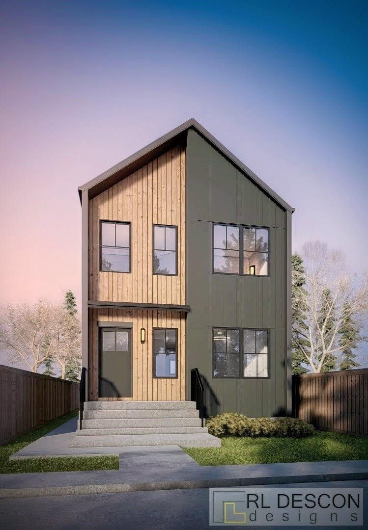 Eye-level view of a residential street with infill housing under construction