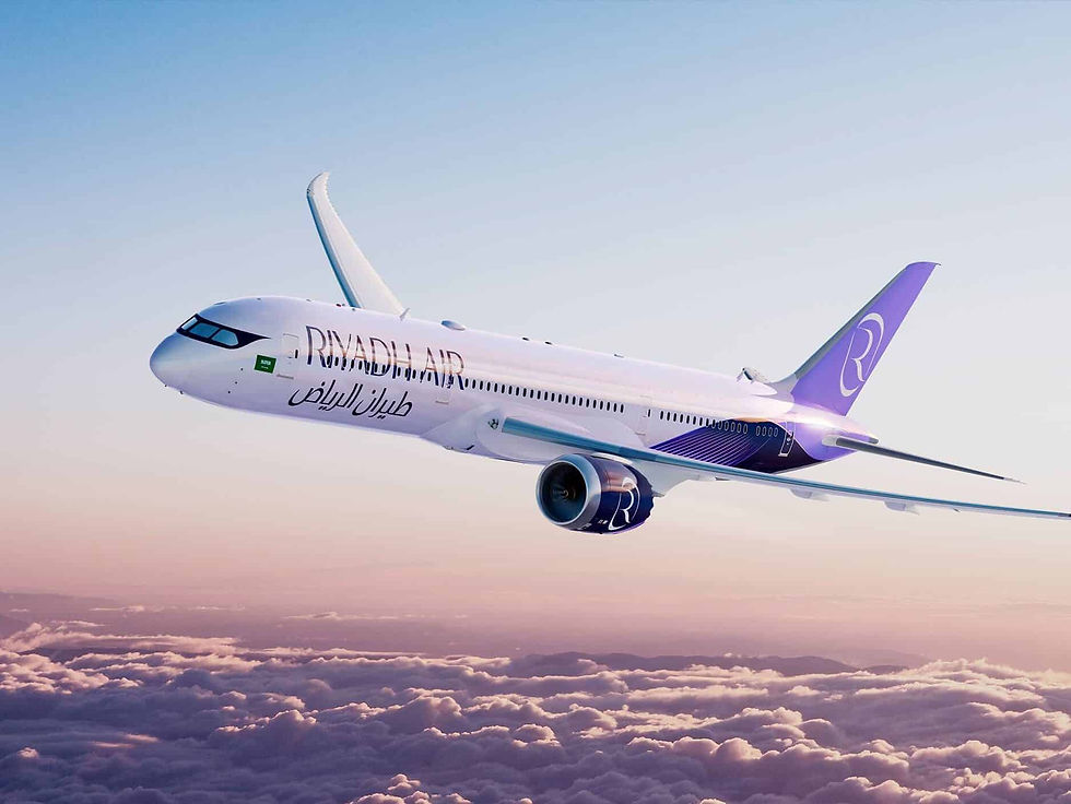 Riyadh Air jet flying above pink clouds at sunrise, white fuselage with purple tail and Arabic text.