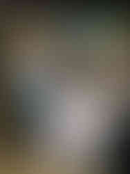 A couple celebrating beside a striped dessert and coffee cart during a wedding at The Oviatt in Downtown Los Angeles.