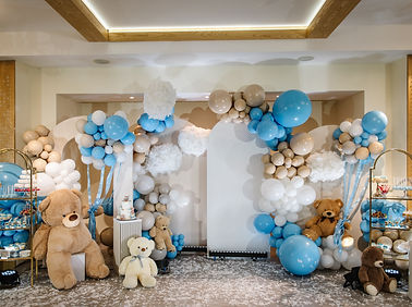 Arch with bears decoration brown, blue balloons. Celebration baptism. Trendy winter decor.
