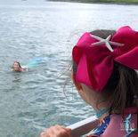child talking to mermaid