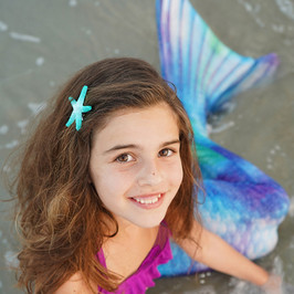 child mermaid on beach