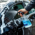 Close-up view of a rinseless wash solution with microfiber cloths