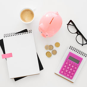 top-view-financial-elements-assortment-with-empty-notepad.jpg