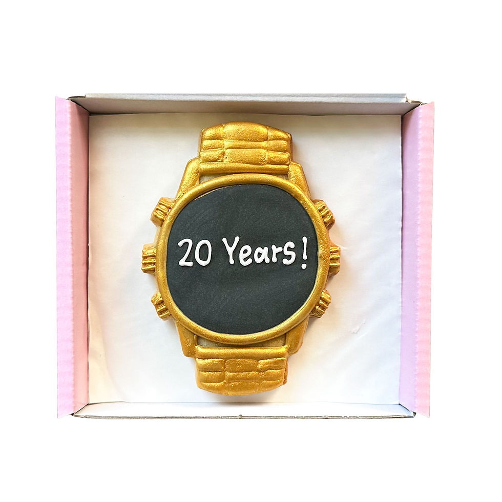 Luxury gold watch shaped biscuit with personalised message hand-iced onto the watch face.