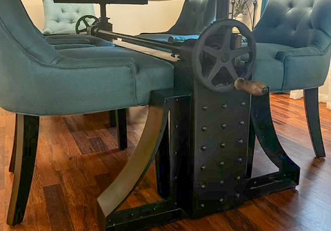 Custom epoxy furniture - river dining table with wood, black epoxy center and metal base designed and created by DFW Epoxy Countertops & Design