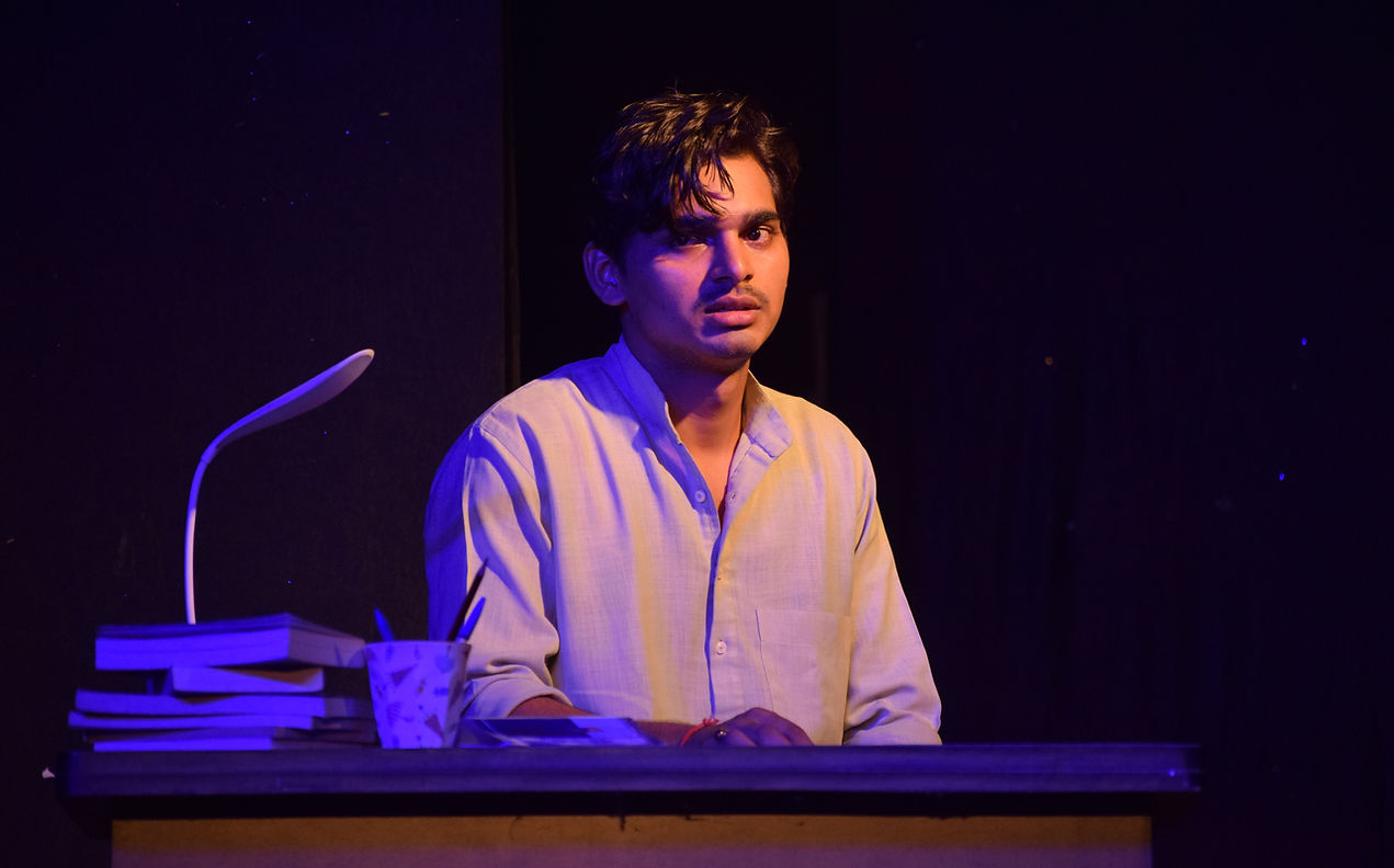 Actor performing on stage during a Pratham Path Theatre production in Ghaziabad